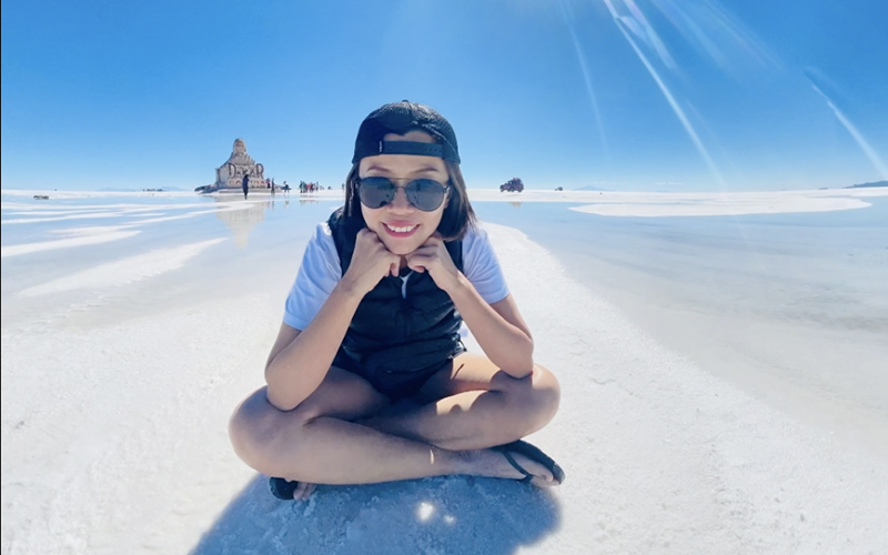 Sitting on salt flat at Salar de Uyuni Bolivia